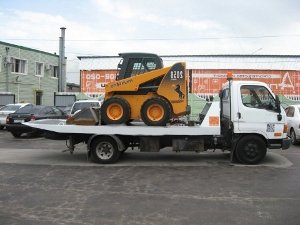 Фото эвакуатора спецтехники мини трактор.
