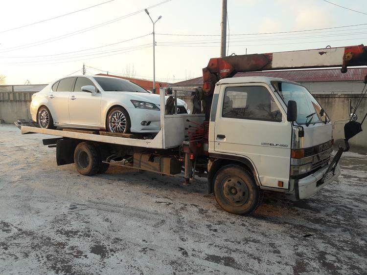 Фото эвакуатора с КМУ Isuzu Elf