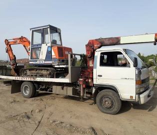 Фото перевозки экскаватора на эваккуаторе